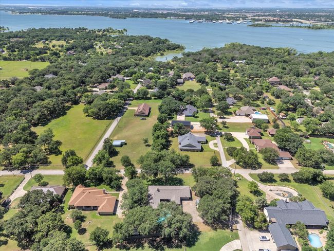 Aerial perspective of suburban area with a nearby body of water | Image 39
