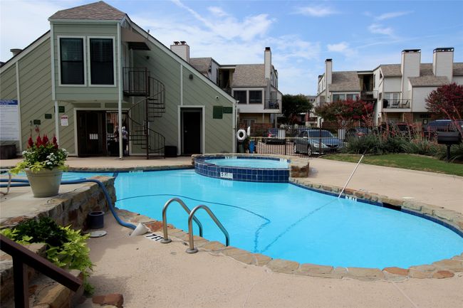 View of pool featuring a pool with connected hot tub, stairway, fence, and a patio | Image 20