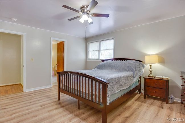 Master Bedroom with ceiling fan and light wood-type flooring | Image 11