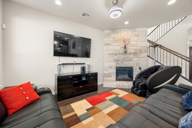 The welcoming entry foyer fows past the stairway into the open floor plan living room. | Image 9