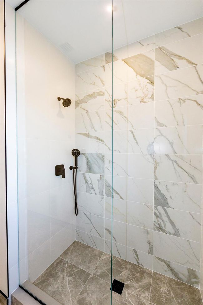 View of the walk-in glass enclosed shower. | Image 35