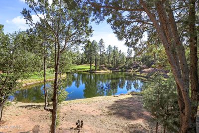 CP golf course lake and ponds surround this house in Pine Islands most sought after lot. | Image 2