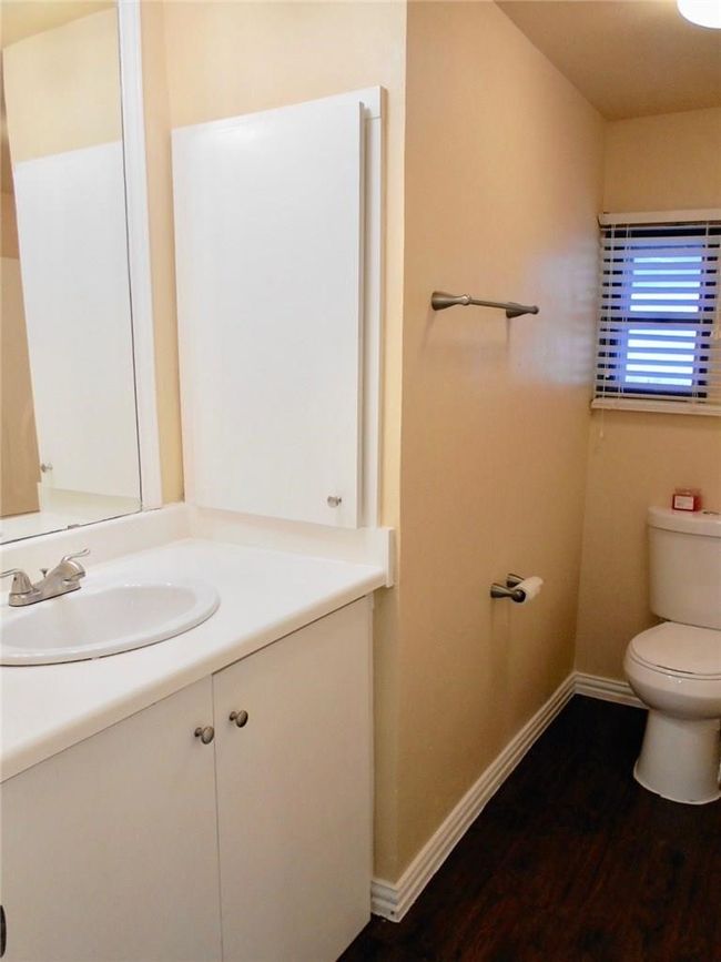 Bathroom with vanity and wood finished floors | Image 12