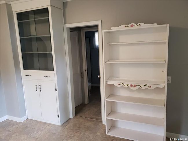 Kitchen features two built in cabinets. | Image 8