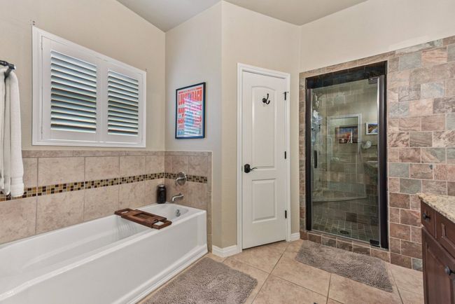His and Hers separate closets and remodeled shower. | Image 26