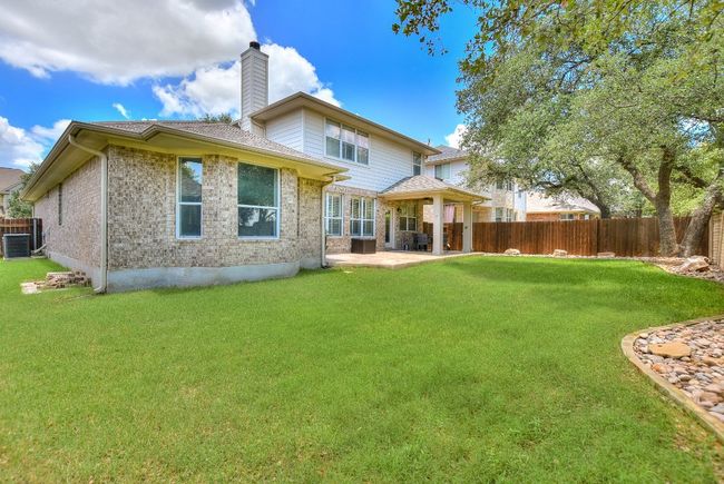 Lush private backyard with full sprinklers | Image 35