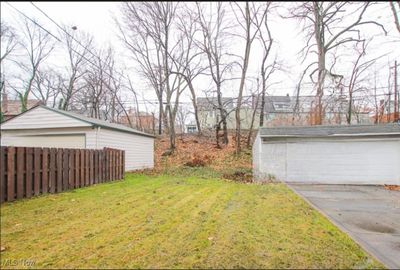 View of yard featuring an outbuilding and a garage | Image 2