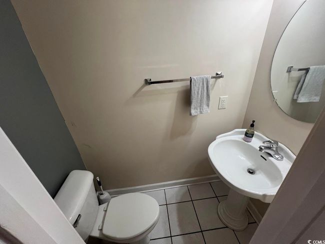 Bathroom featuring tile patterned floors and baseboards | Image 11