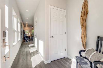 Corridor featuring hardwood / wood-style floors | Image 3