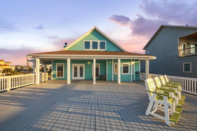 waterside of home showing off the large covered patio | Image 5