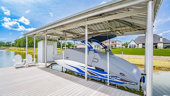 Boat dock with closet and sitting area. Boat also for sale. | Image 6