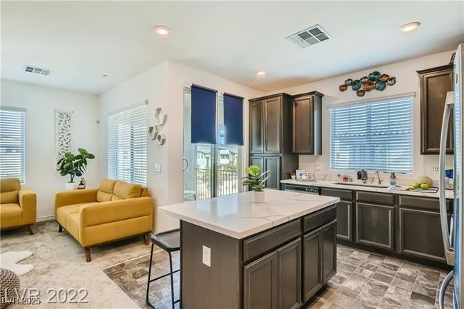 Kitchen with light countertops, visible vents, and plenty of natural light | Image 19