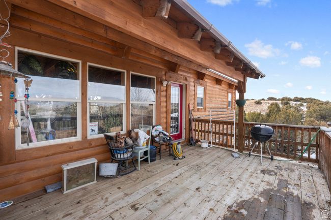 Wooden terrace featuring a grill | Image 29