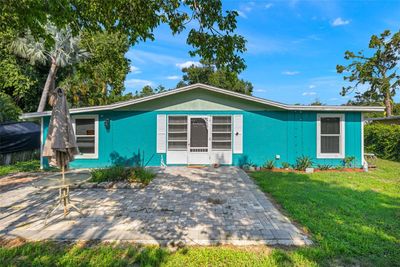 View of front facade featuring a front lawn and a patio area | Image 1