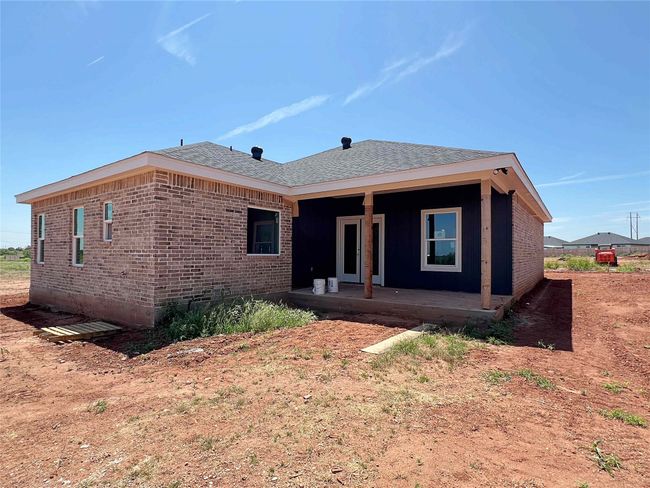Large backyard fully landscaped with 6ft privacy fence. | Image 13