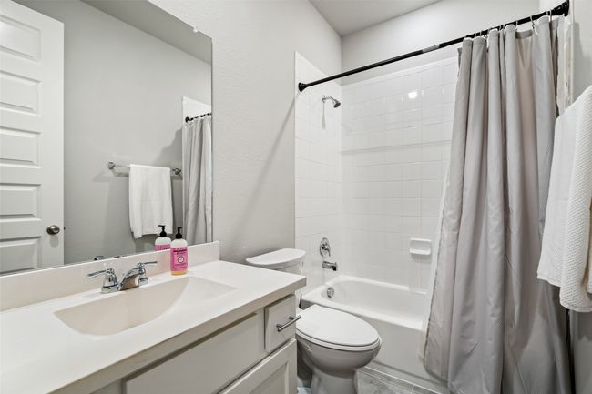 Full bathroom featuring vanity, toilet, and shower / bath combo | Image 14
