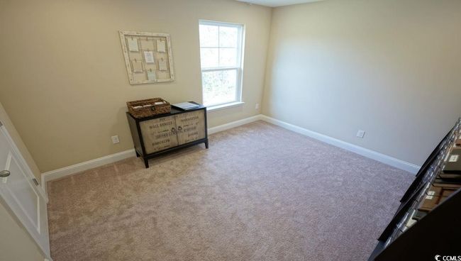 Carpeted bedroom with baseboards | Image 31