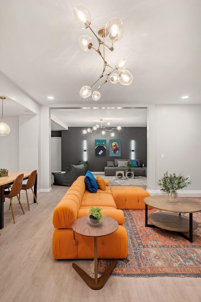 Living room with wood finished floors and baseboards | Image 17