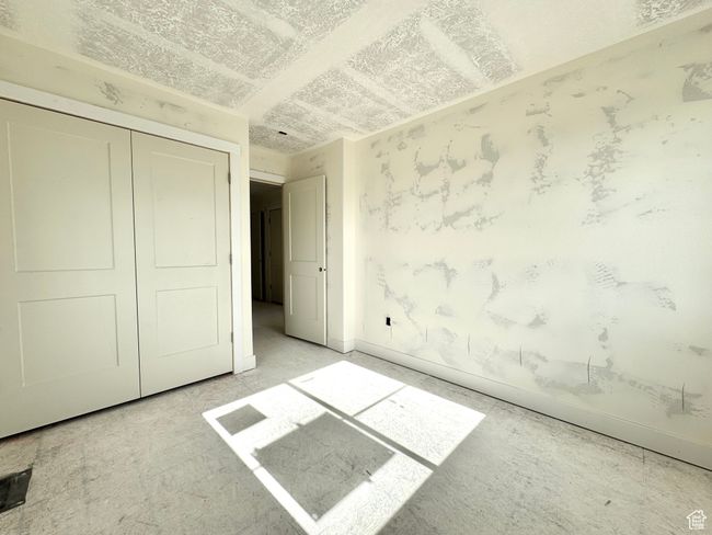 Unfurnished bedroom with a closet and baseboards | Image 16