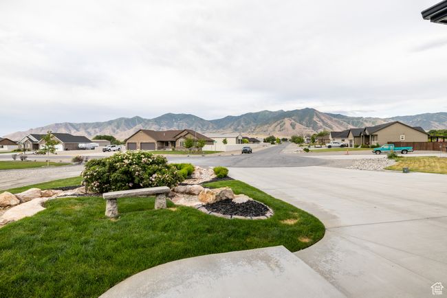 View of yard with a mountain view, a residential view, and curved driveway | Image 92