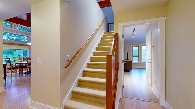 Stairs featuring baseboards and wood-type flooring | Image 32