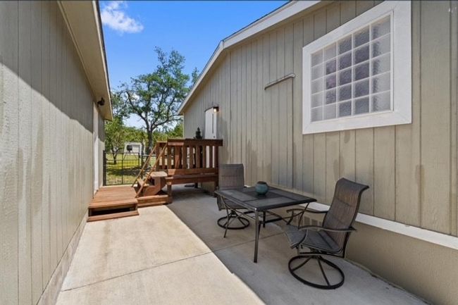 Patio between home and detached garage | Image 11
