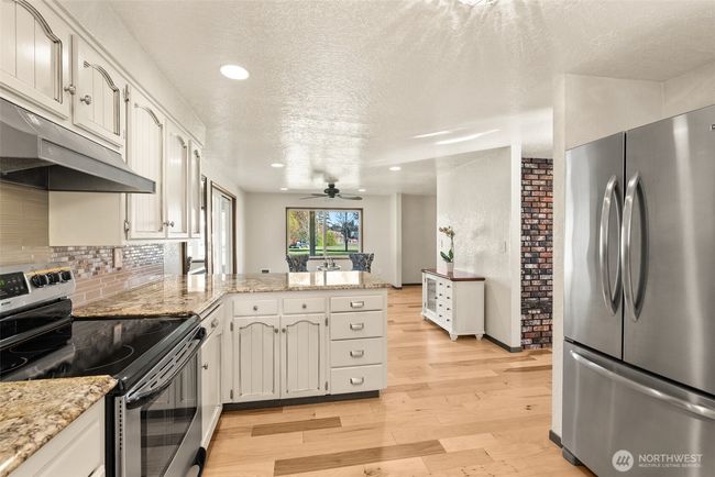 Kitchen with view of sitting area or potential dining area | Image 10
