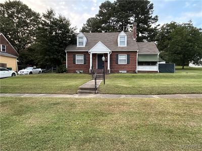 Cape cod home with a front lawn | Image 3