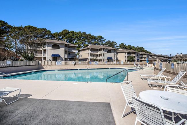 Community pool featuring a patio and a residential view | Image 29