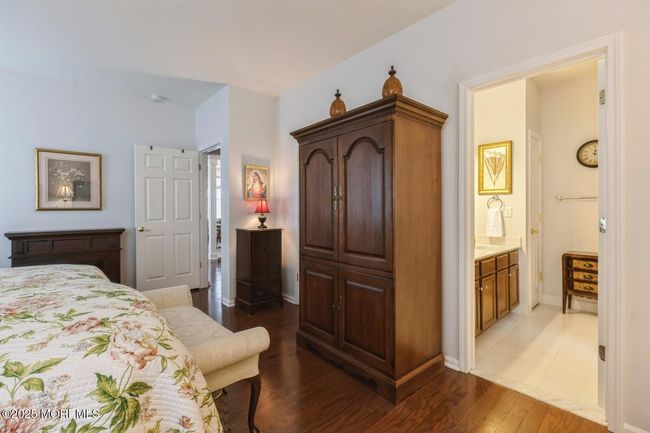 Attached primary bath and walk in closet. | Image 16