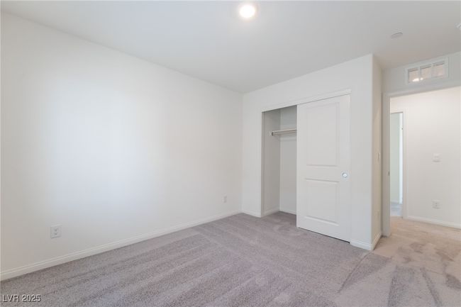 Unfurnished bedroom featuring light colored carpet and a closet | Image 28