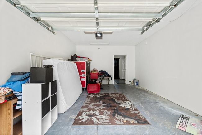 Garage featuring a garage door opener | Image 26