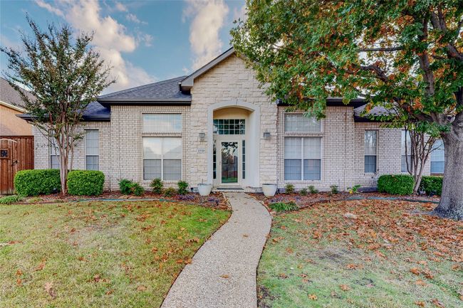 View of front of home with brick siding and stone siding | Image 5