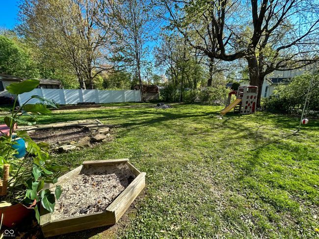 Spacious backyard, partially fenced, mature trees | Image 25