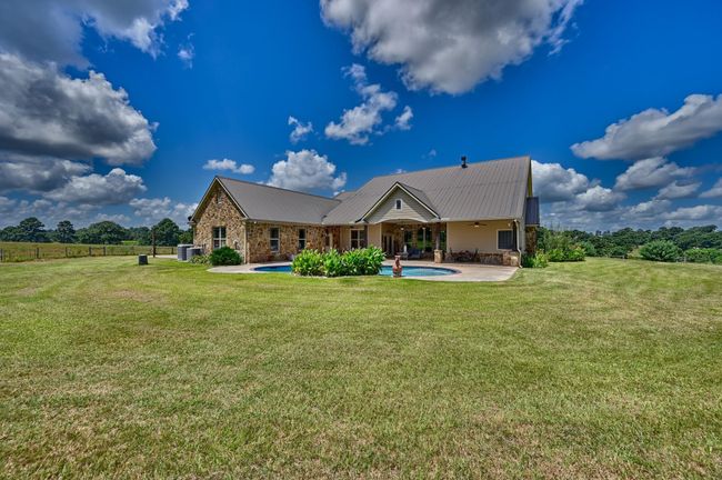 Beautiful Back View of Home, Pool and Patio | Image 37