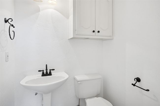 1/2 bathroom located downstairs | Image 35