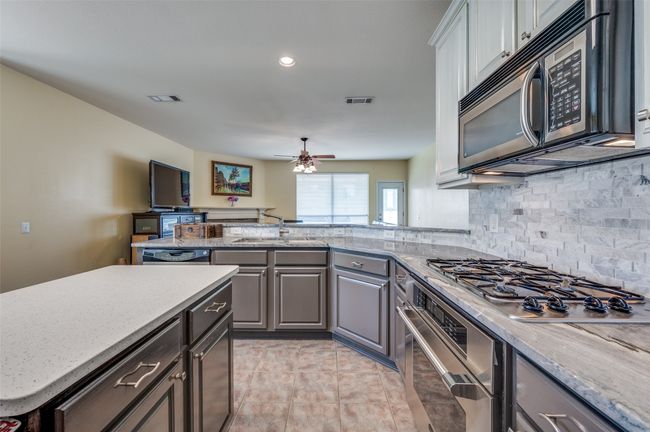 Kitchen with stainless steel appliances and Thermador gas range. | Image 10