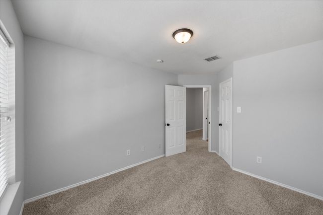Unfurnished bedroom with new carpet | Image 34