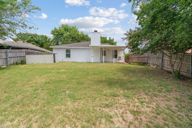 Back of house featuring a chimney and a fenced backyard | Image 34