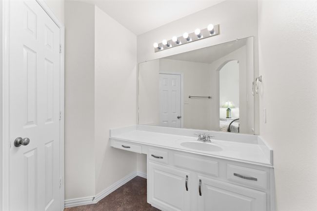 Ensuite bathroom featuring vanity and tile patterned flooring | Image 32