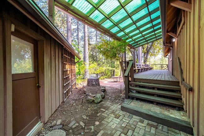 Man door to upper garage next to house | Image 76