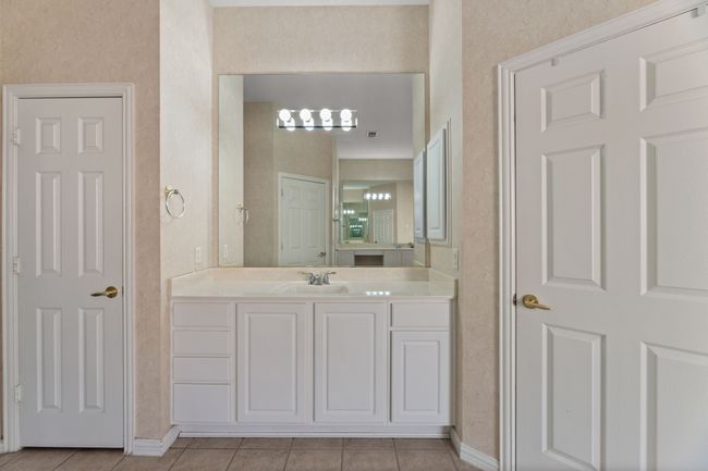 Bathroom with vanity and tile patterned floors | Image 31