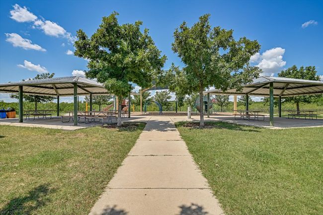 View of home's community featuring a patio area, a gazebo, and a lawn. | Image 32