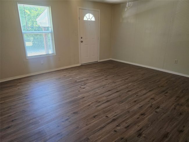 Foyer entrance with dark wood-type flooring and baseboards | Image 10