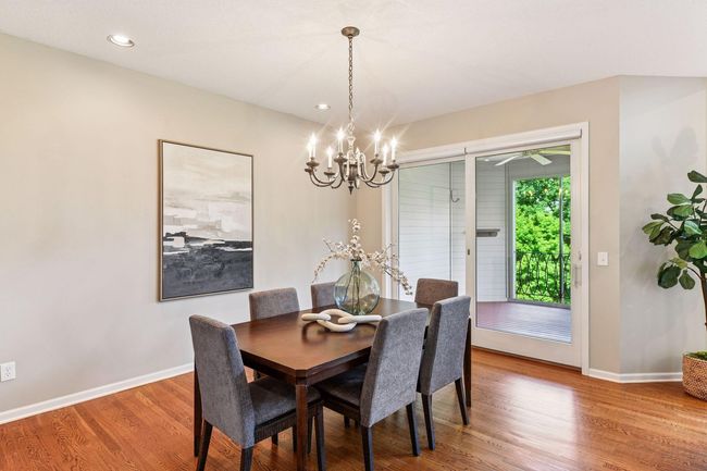 Large dining area that walks out to the 3 season porch. | Image 9