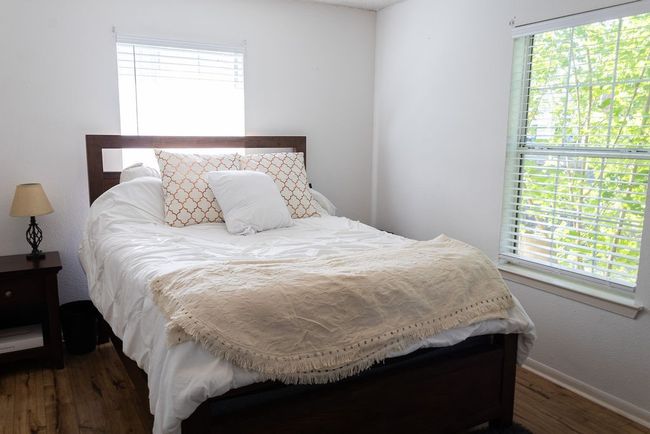 Bedroom with wood finished floors and baseboards | Image 24