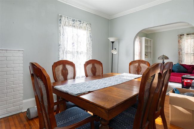 Dining room with hardwood / wood-style floors and crown molding | Image 8
