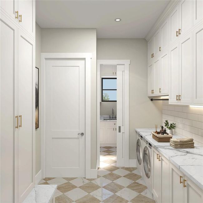 Downstairs laundry/mud room directly coming in from the garage. Additional floor to ceiling cabinetry for all of your necessary storage. | Image 9