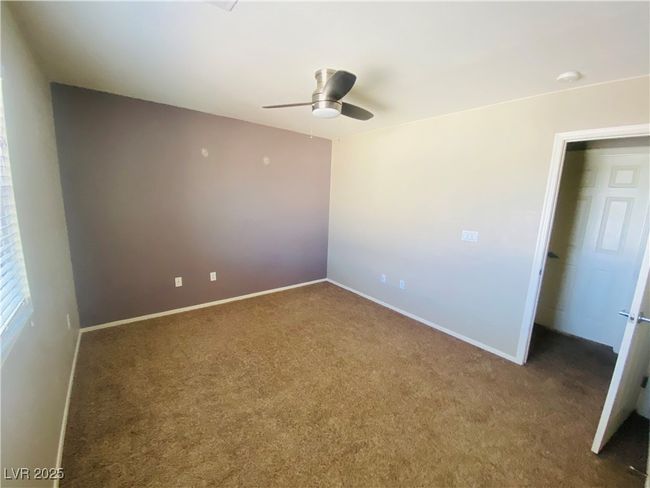 Spare room featuring a ceiling fan, carpet, and baseboards | Image 22