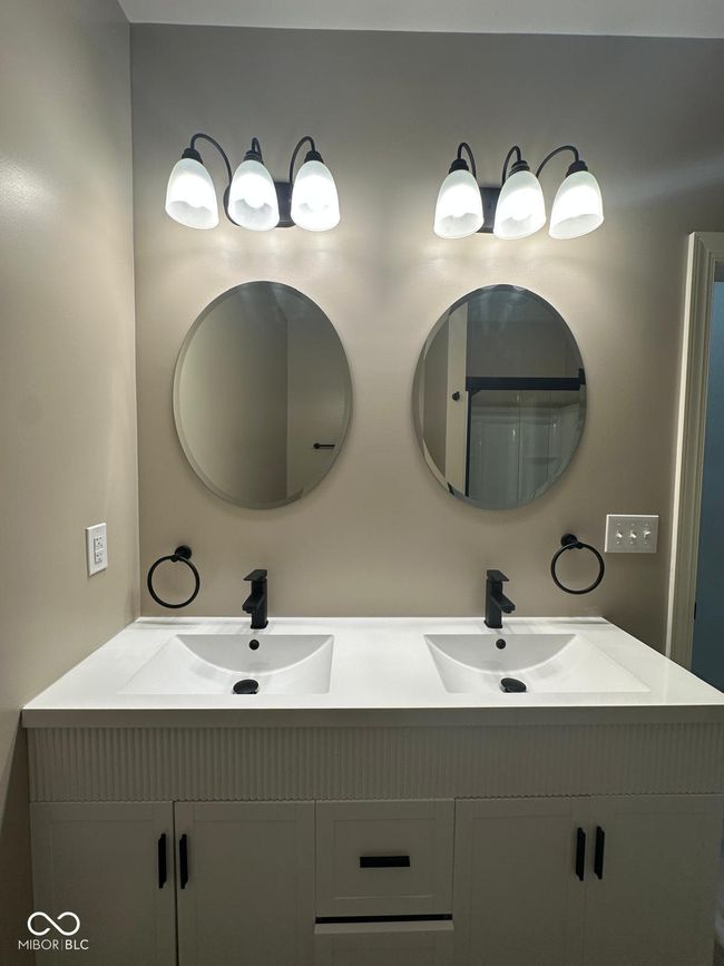 Unit 1 - Hall bathroom featuring double vanity | Image 15